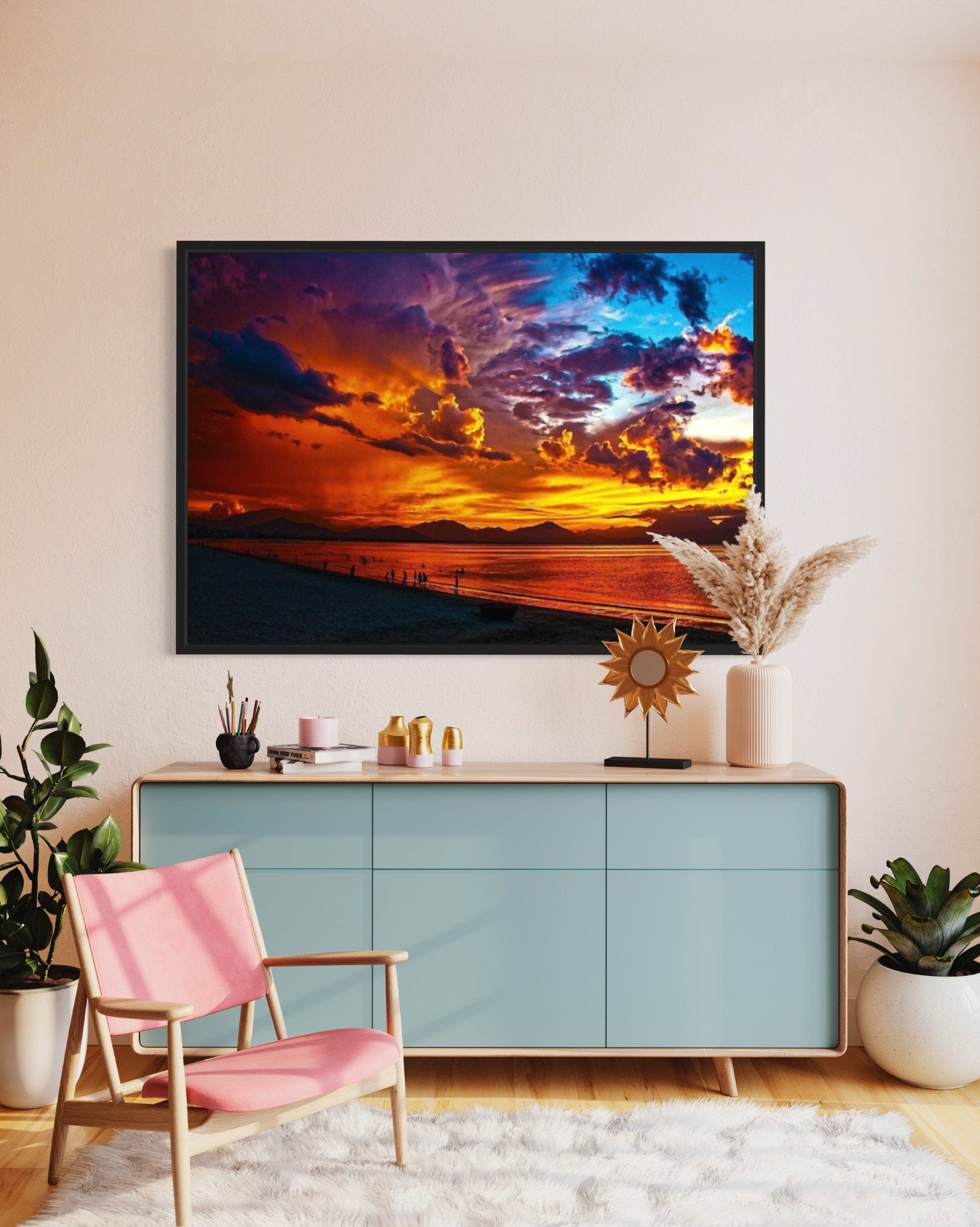 A stunning Surreal Sunset Print depicting a golden sun setting over tranquil waters, with vibrant hues of orange, pink, purple, and blue in the sky.