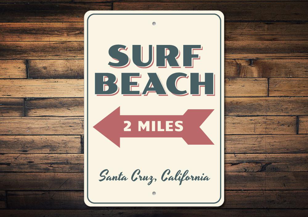 A vibrant Surf Beach Sign made of aluminum, featuring beach-themed graphics, perfect for coastal decor.