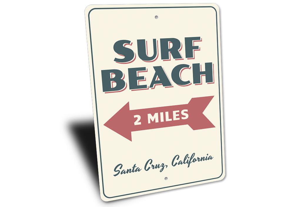 A vibrant Surf Beach Sign made of aluminum, featuring beach-themed graphics, perfect for coastal decor.