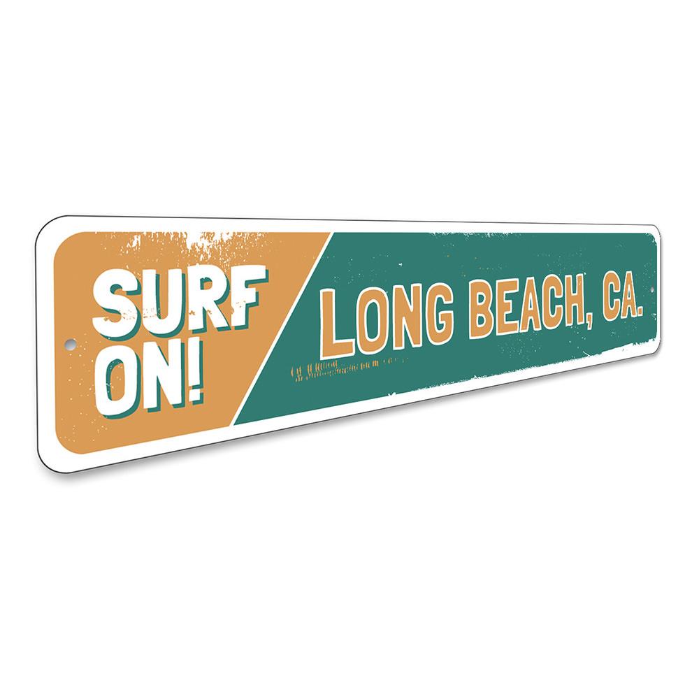 A vibrant Surf On Sign made of aluminum, featuring beach-themed graphics, perfect for coastal decor.