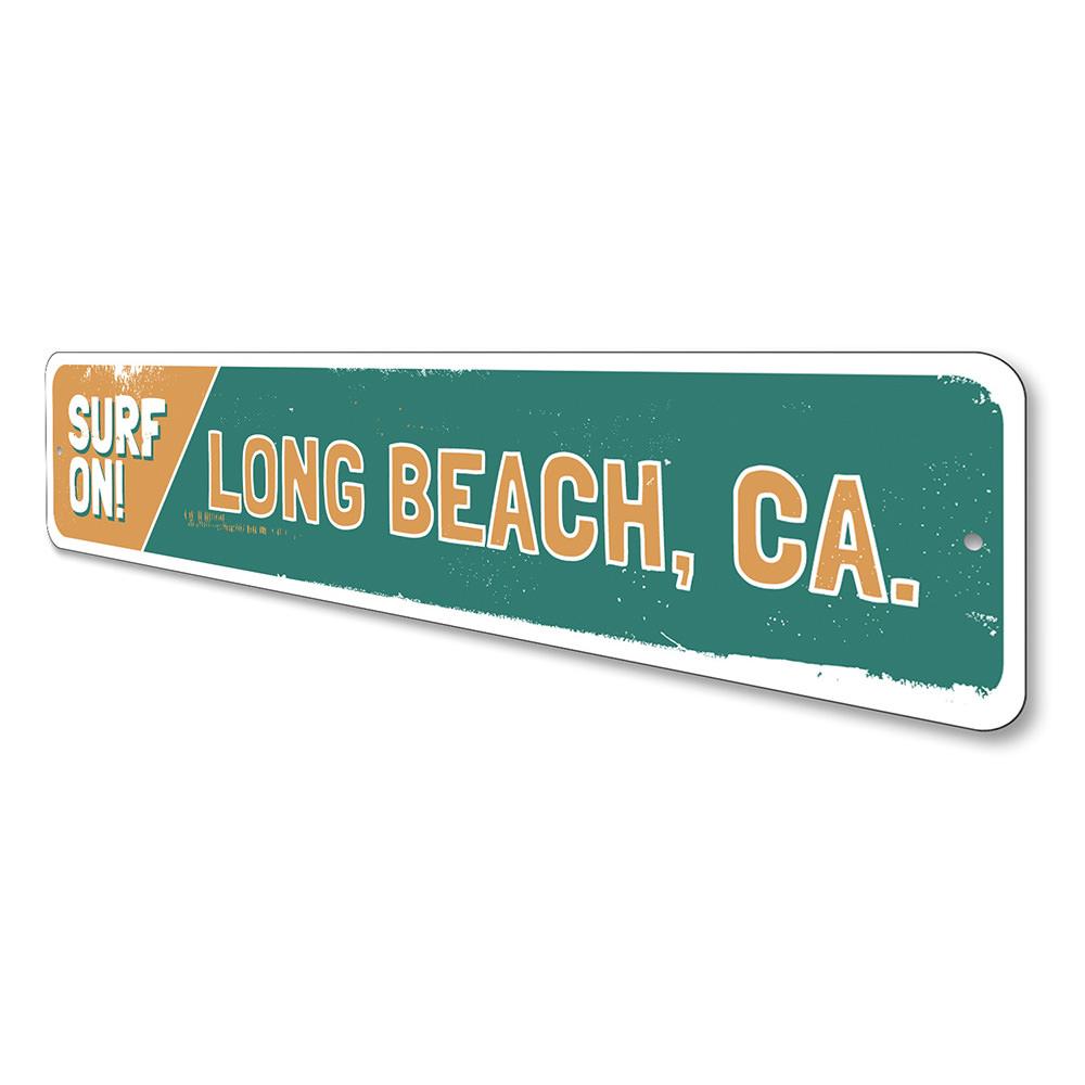 A vibrant Surf On Sign made of aluminum, featuring beach-themed graphics, perfect for coastal decor.