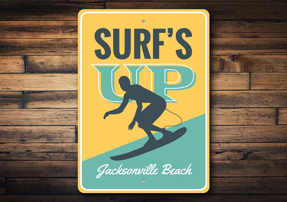 Surf's Up Sign made of durable aluminum, featuring beach-themed design, perfect for coastal decor.