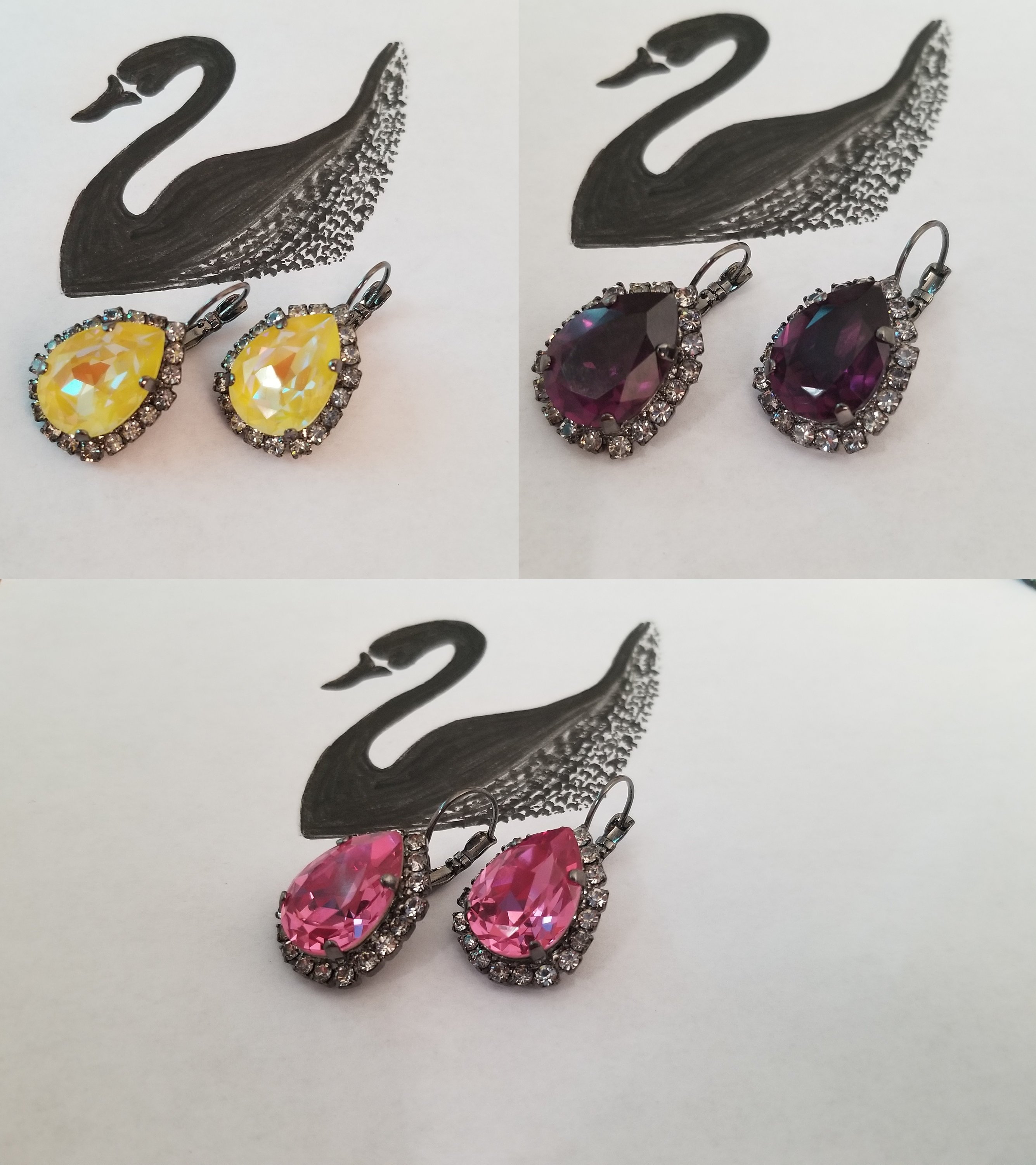 Elegant Swarovski Crystal Pear Shaped Statement Earrings featuring vibrant colored crystals in gold, silver, and hematite settings.