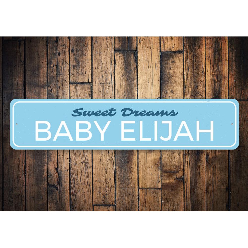 A personalized Sweet Dreams Baby Name Sign made of high-quality aluminum, featuring a child's name in a playful font, perfect for nursery decor.