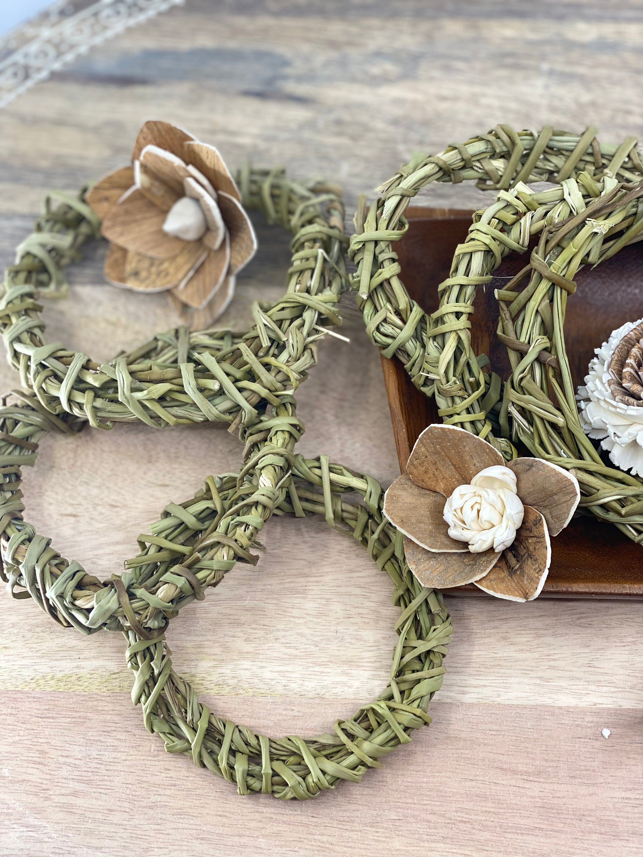 A pack of six 4-inch handmade sweetgrass wreath forms, showcasing their natural texture and delicate design, perfect for crafting and indoor decor.