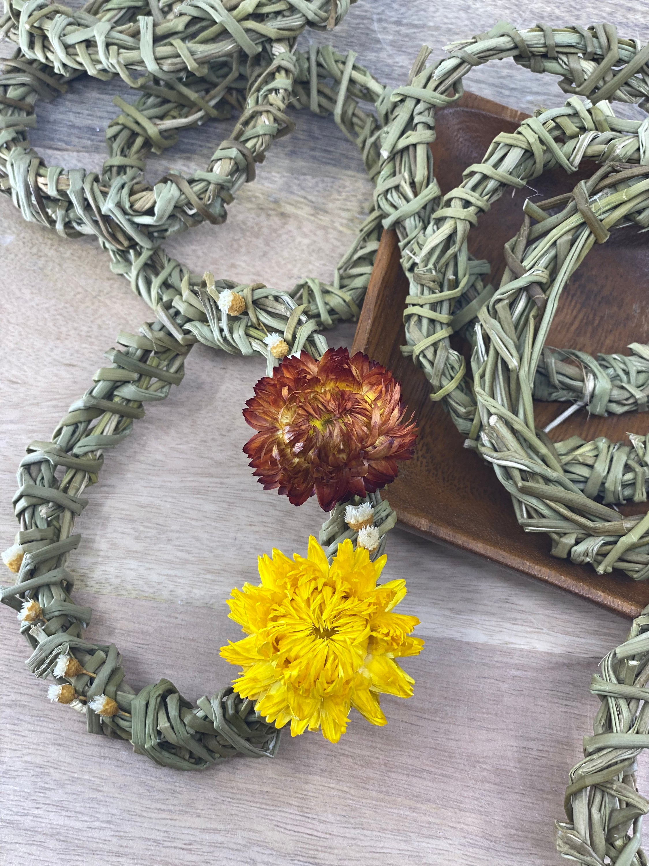 A pack of six 4-inch handmade sweetgrass wreath forms, showcasing their natural texture and delicate design, perfect for crafting and indoor decor.