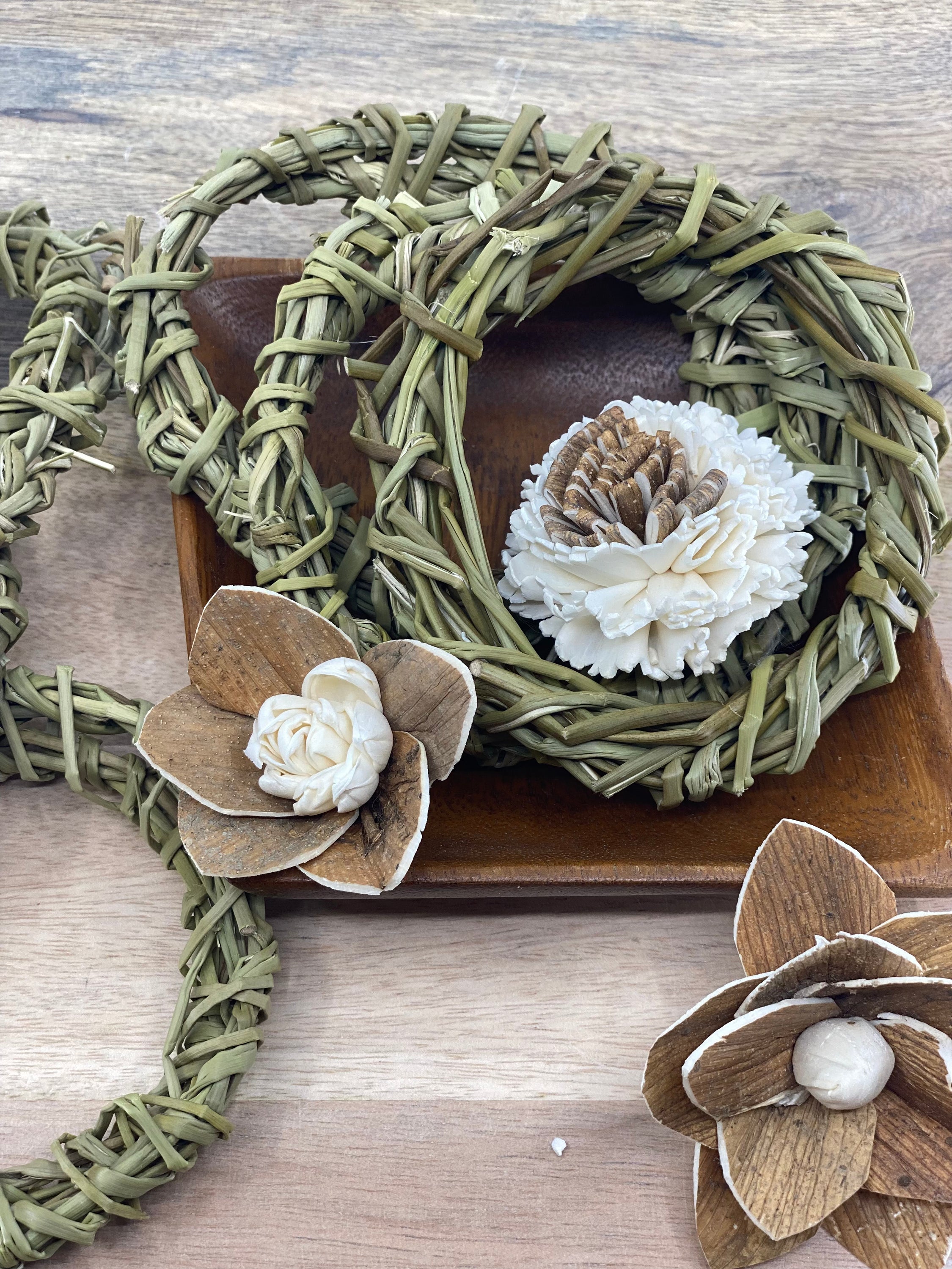 A pack of six 4-inch handmade sweetgrass wreath forms, showcasing their natural texture and delicate design, perfect for crafting and indoor decor.