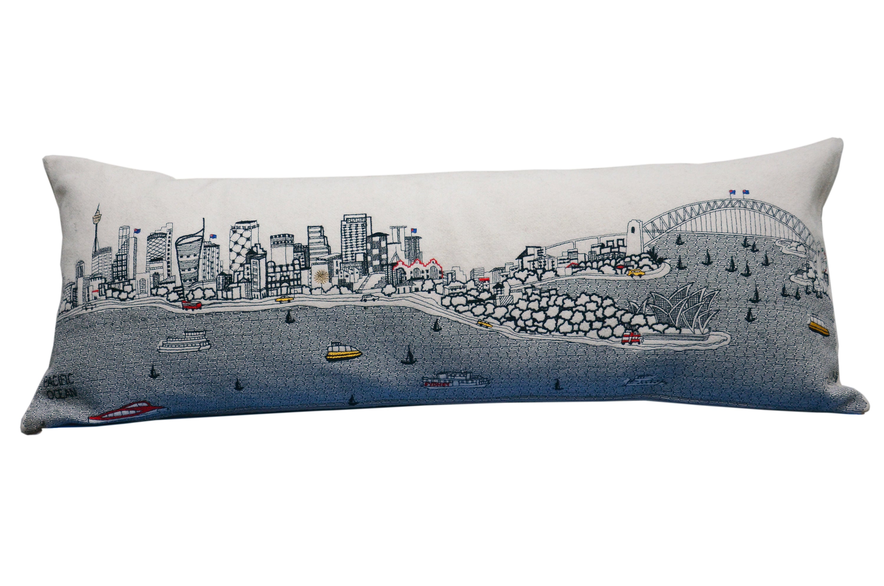 Sydney Pillow featuring intricate embroidery of Sydney landmarks with vibrant colors and a red zipper.