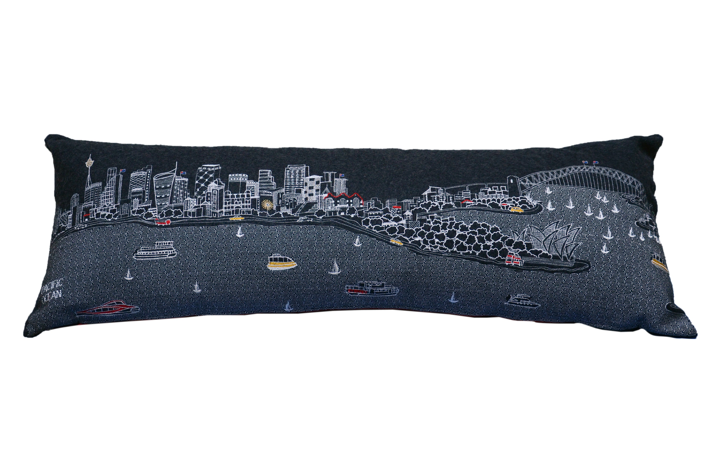 Sydney Pillow featuring intricate embroidery of Sydney landmarks with vibrant colors and a red zipper.