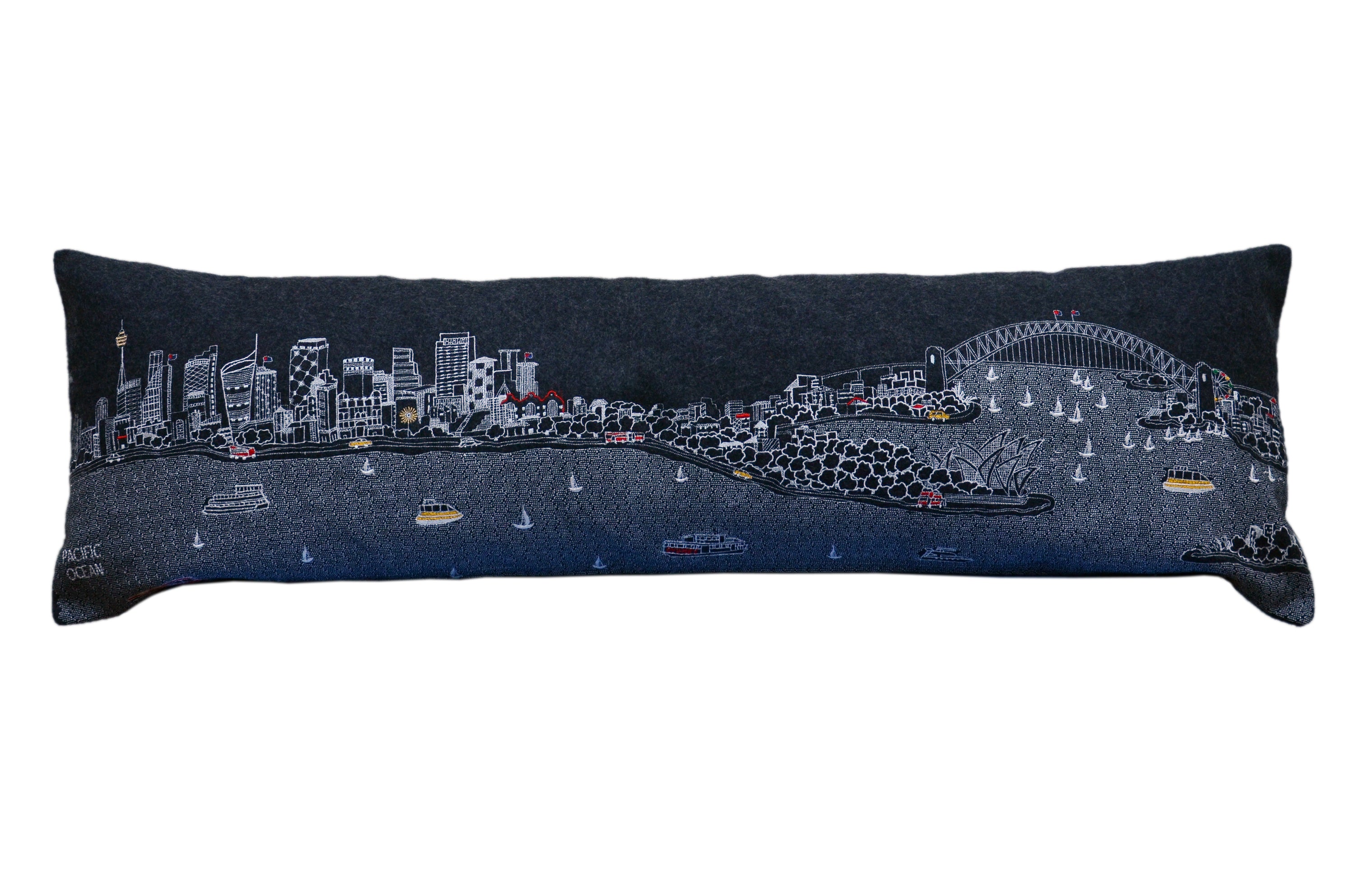 Sydney Pillow featuring intricate embroidery of Sydney landmarks with vibrant colors and a red zipper.