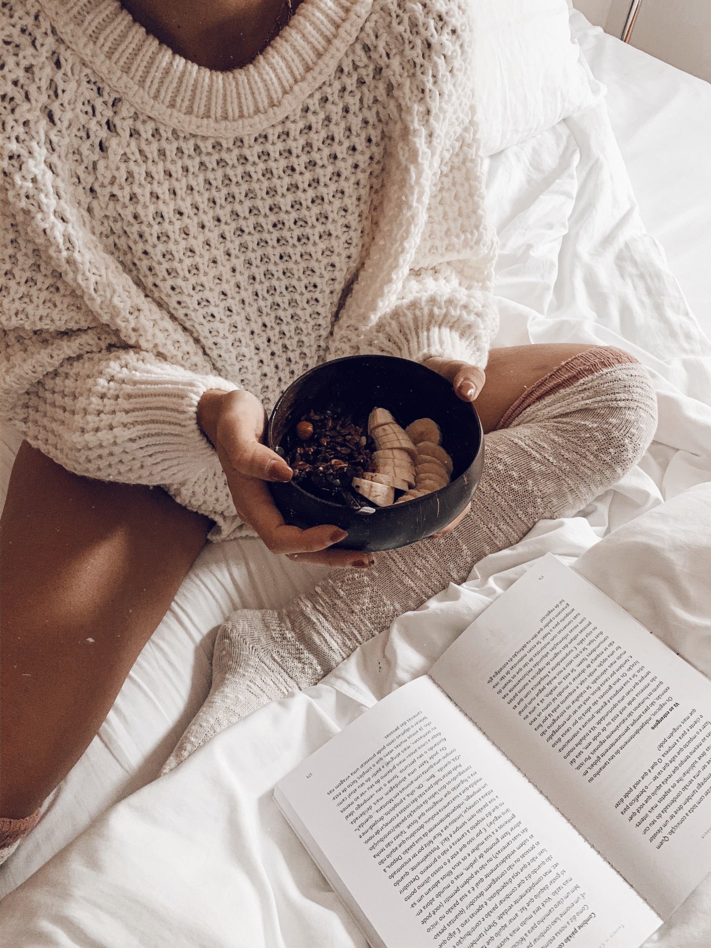 A beautifully crafted Taça de Coco Natural bowl made from real coconut shell, showcasing its unique texture and shape.