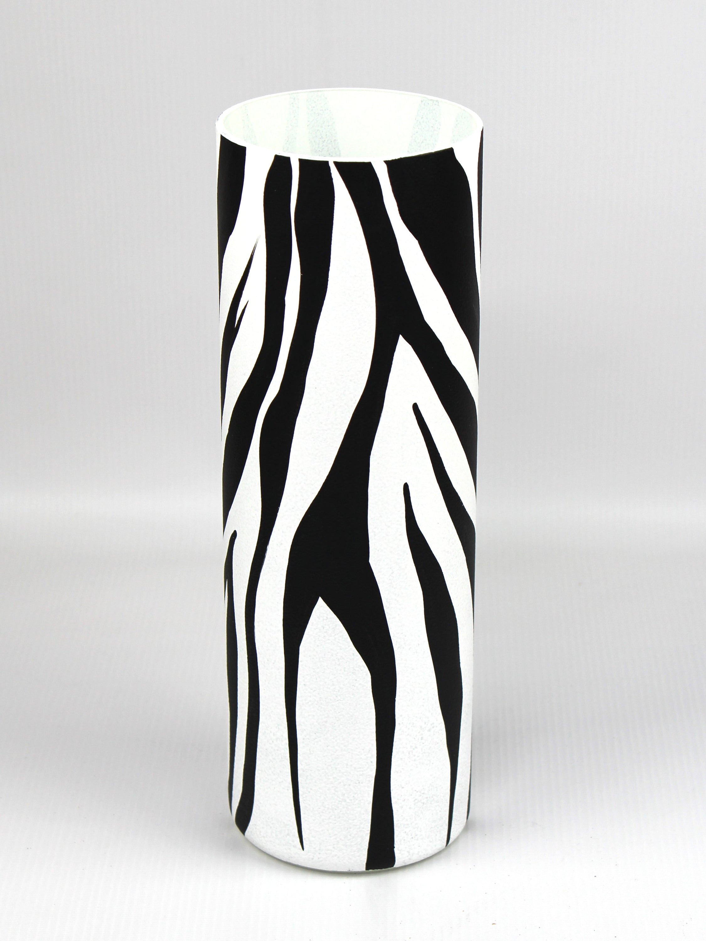 A beautifully hand-painted black and white decorative glass vase featuring unique artistic designs, perfect for home decor.