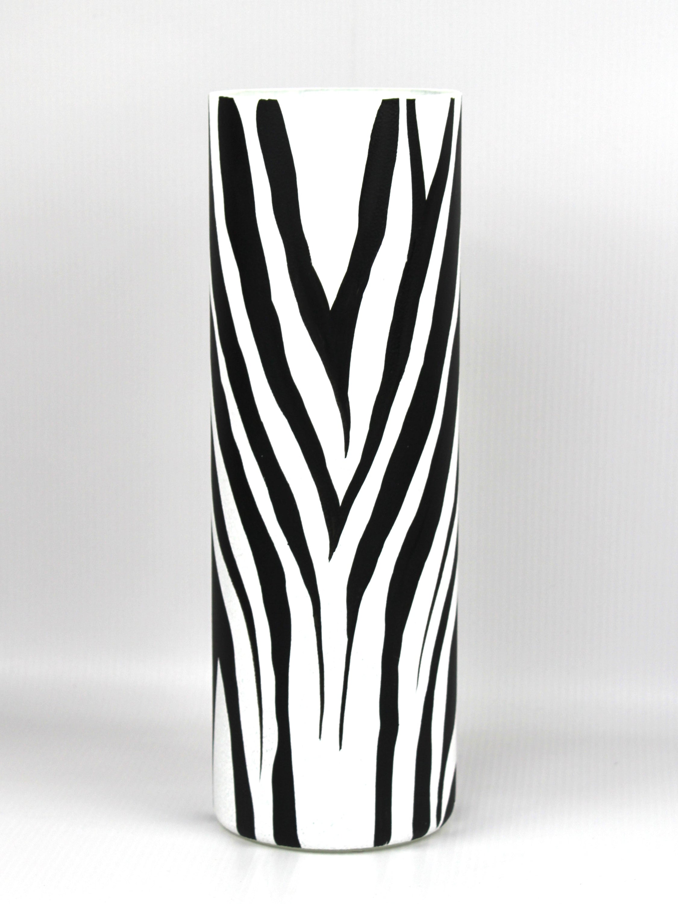 A beautifully hand-painted black and white decorative glass vase featuring unique artistic designs, perfect for home decor.