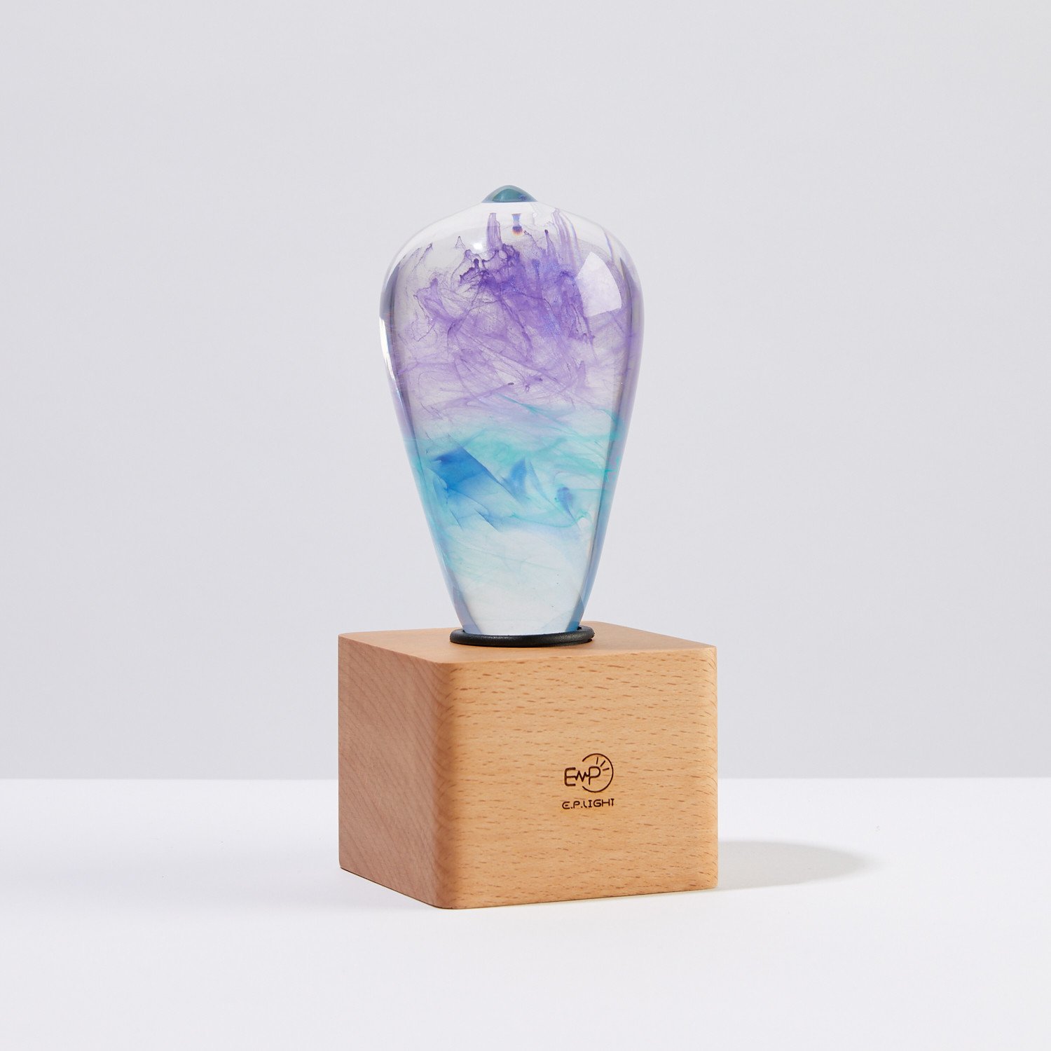 Faith Table Lamp featuring a handcrafted design with eco-friendly resin and beech wood, showcasing a mixed color finish.