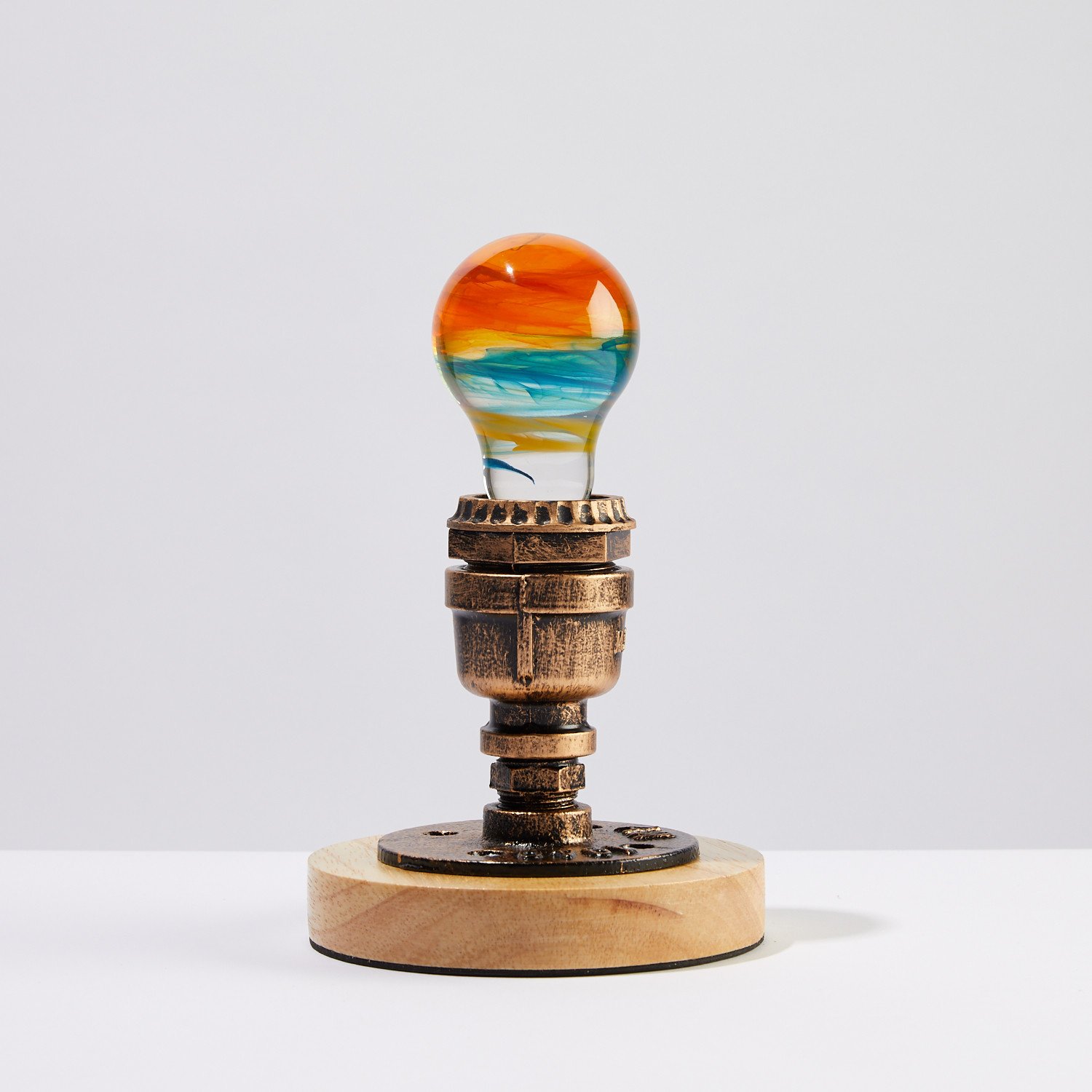 Solar Systeam Table Lamp featuring eco-friendly resin and beech wood, available in mixed colors.