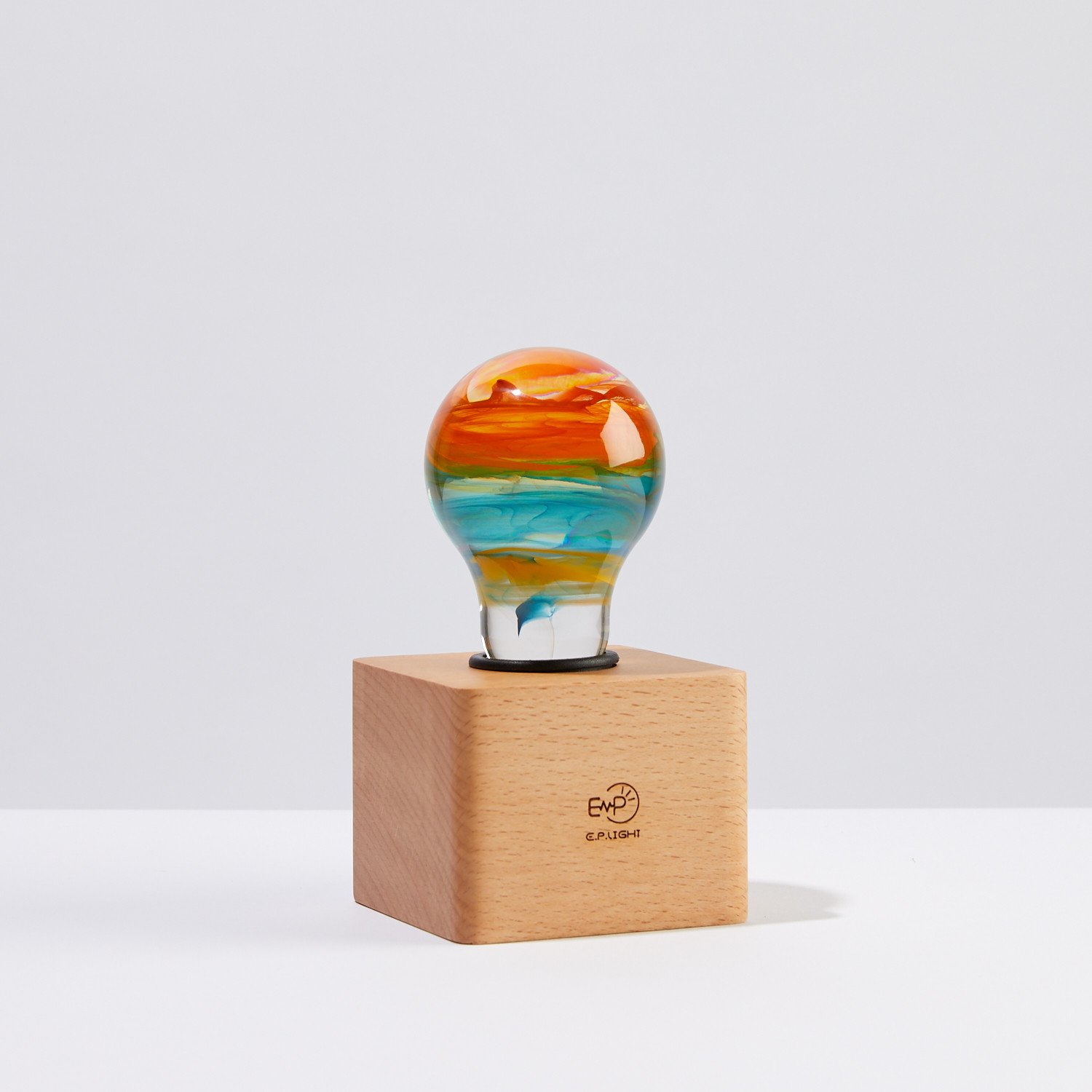 Solar Systeam Table Lamp featuring eco-friendly resin and beech wood, available in mixed colors.