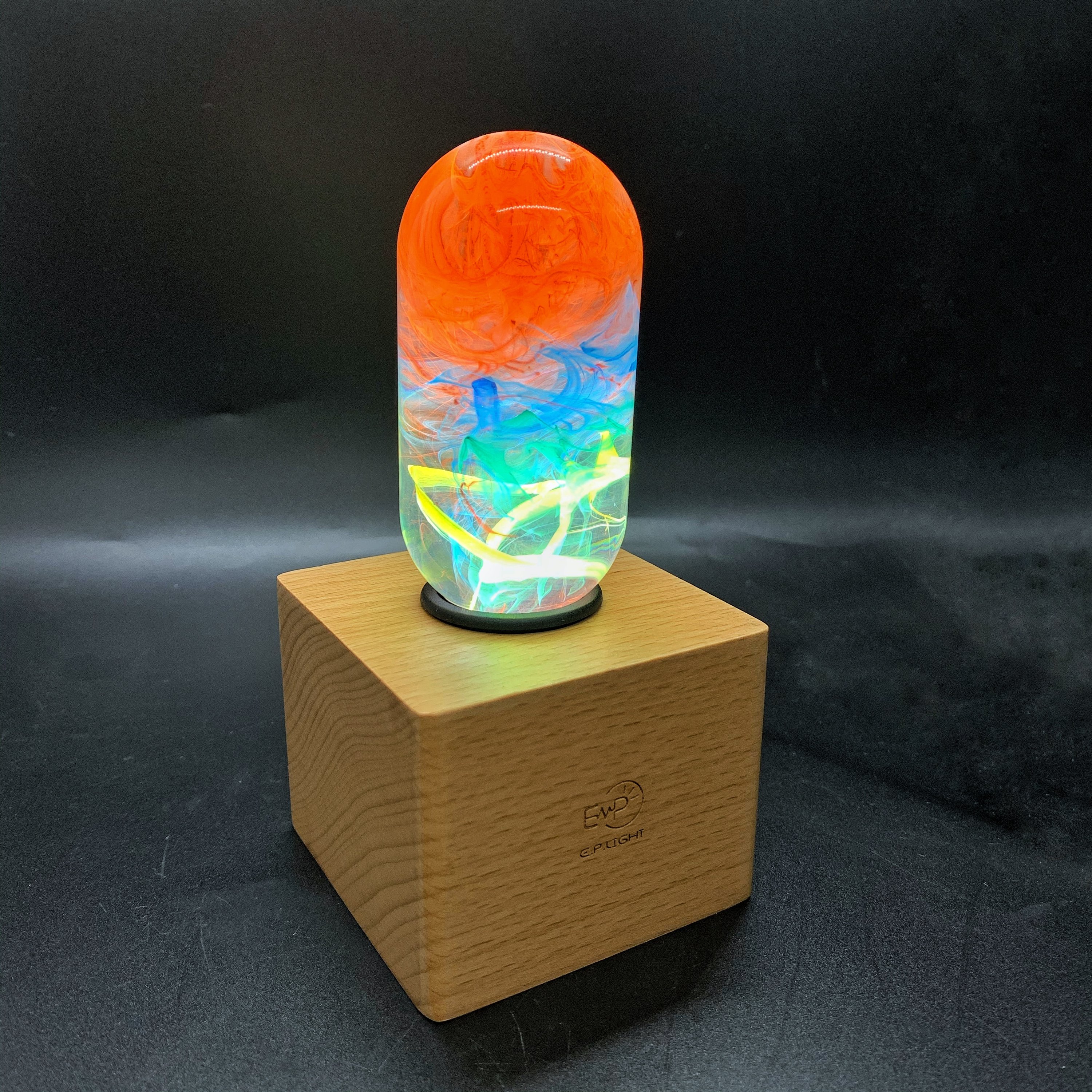 Youth Table Lamp featuring eco-friendly resin and beech wood, designed for vibrant illumination in youth rooms.