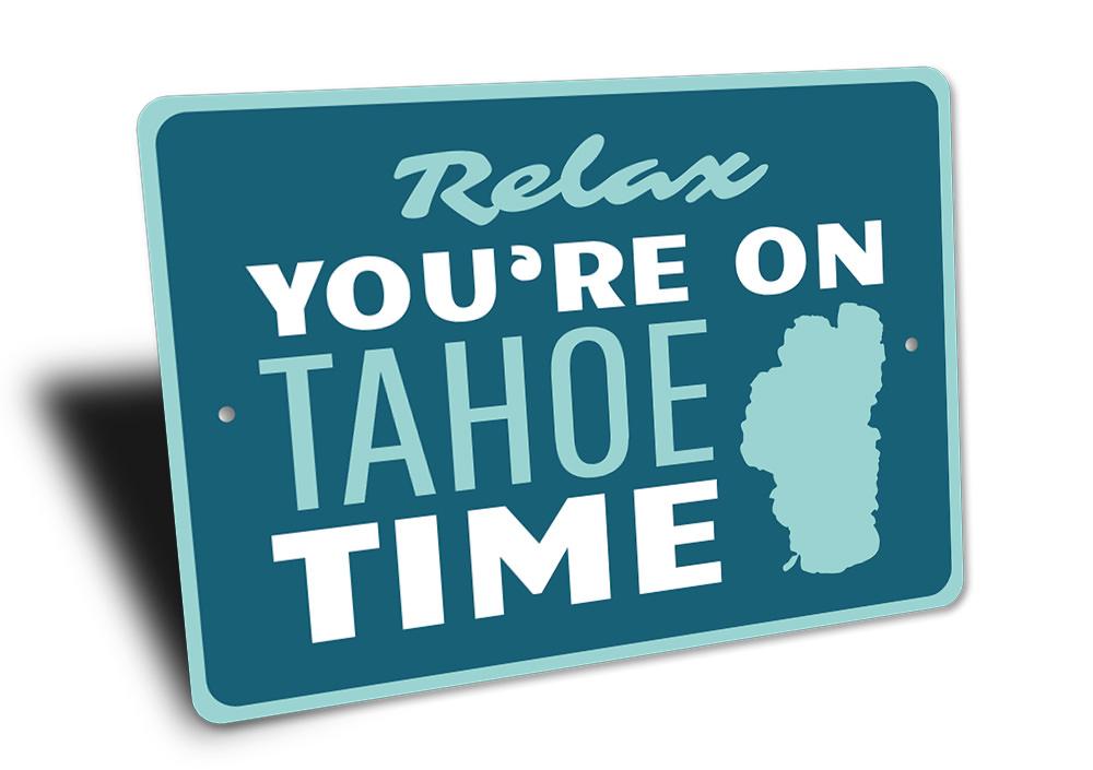 A decorative Tahoe Time Sign made of aluminum, showcasing a beautiful lakeside theme, perfect for lakehouses.