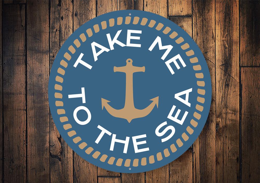 Take Me to the Sea Sign made of high-quality aluminum, featuring a beach-themed design perfect for coastal decor.