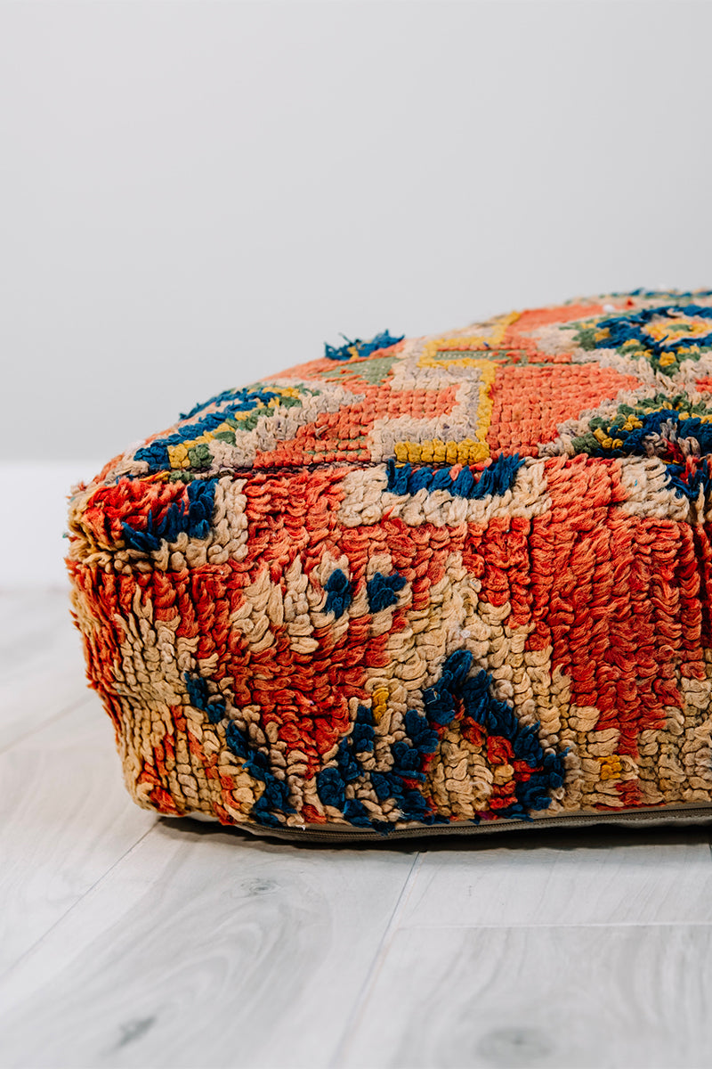 Take Me To Tunis Berber Pillow, 28x28 inches, featuring vibrant orange, blue, and yellow colors, handmade from vintage wool rug.