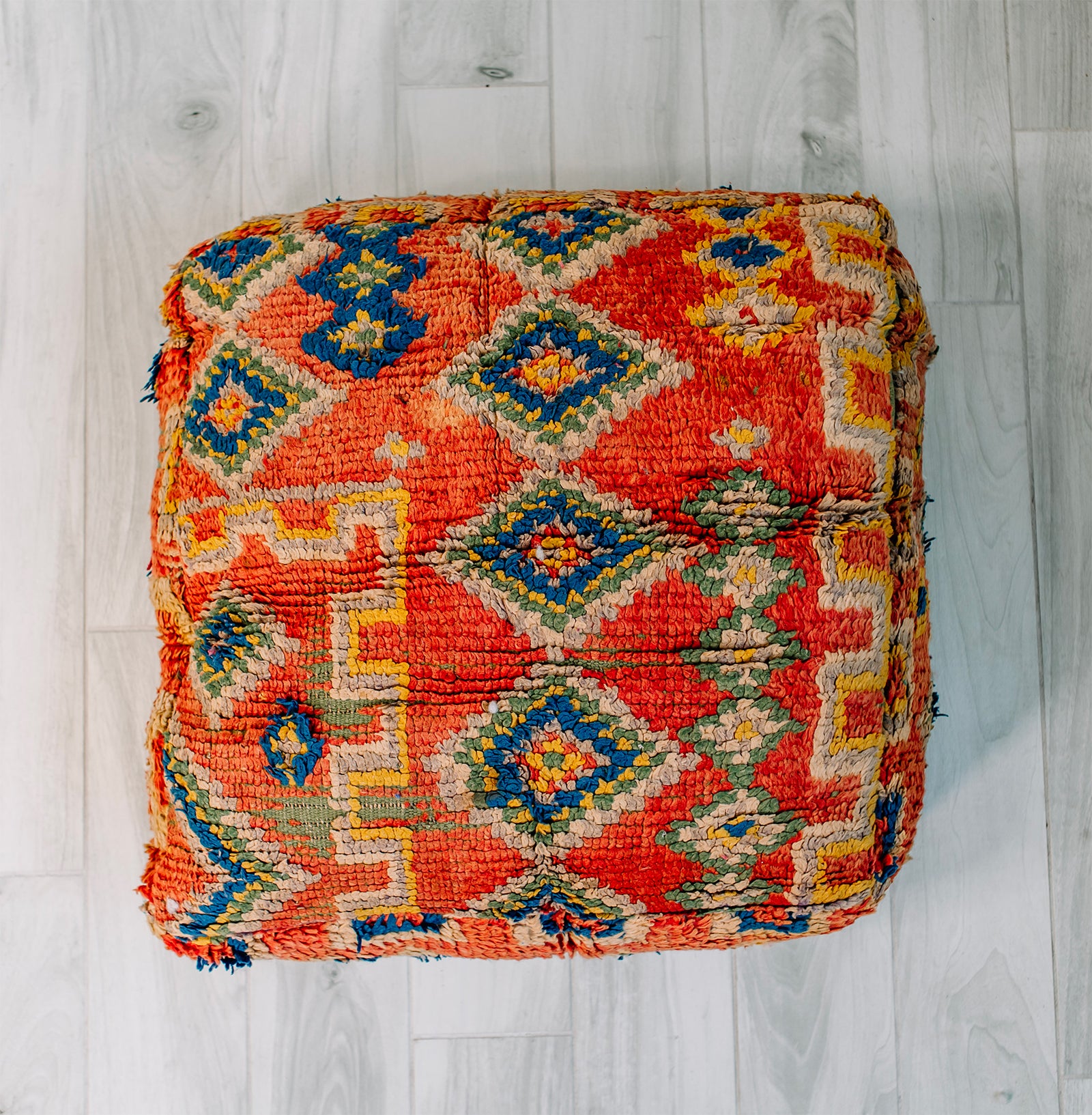 Take Me To Tunis Berber Pillow, 28x28 inches, featuring vibrant orange, blue, and yellow colors, handmade from vintage wool rug.