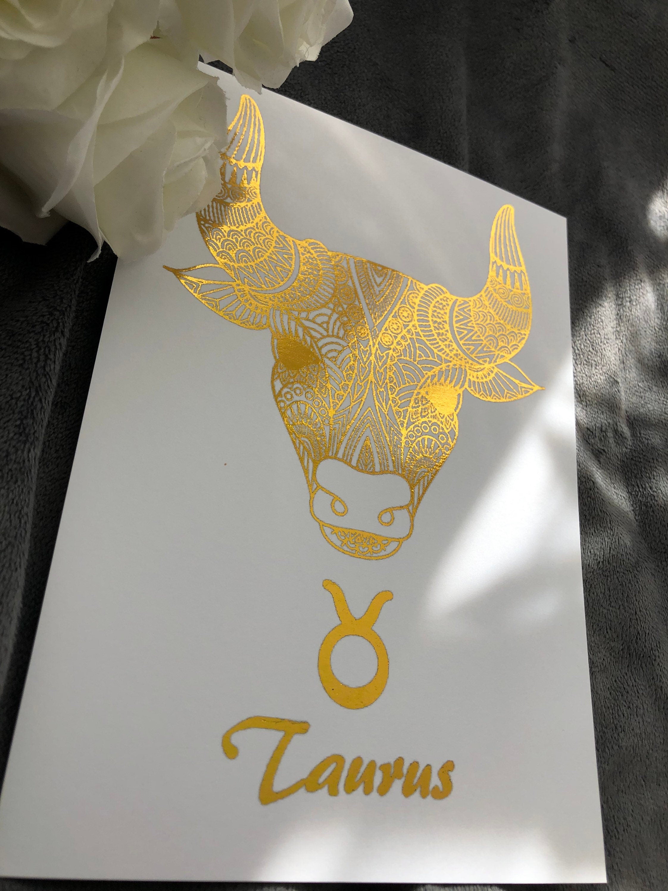 Taurus Star Sign Foil Print featuring a bull design with metallic accents, ideal for home decor.