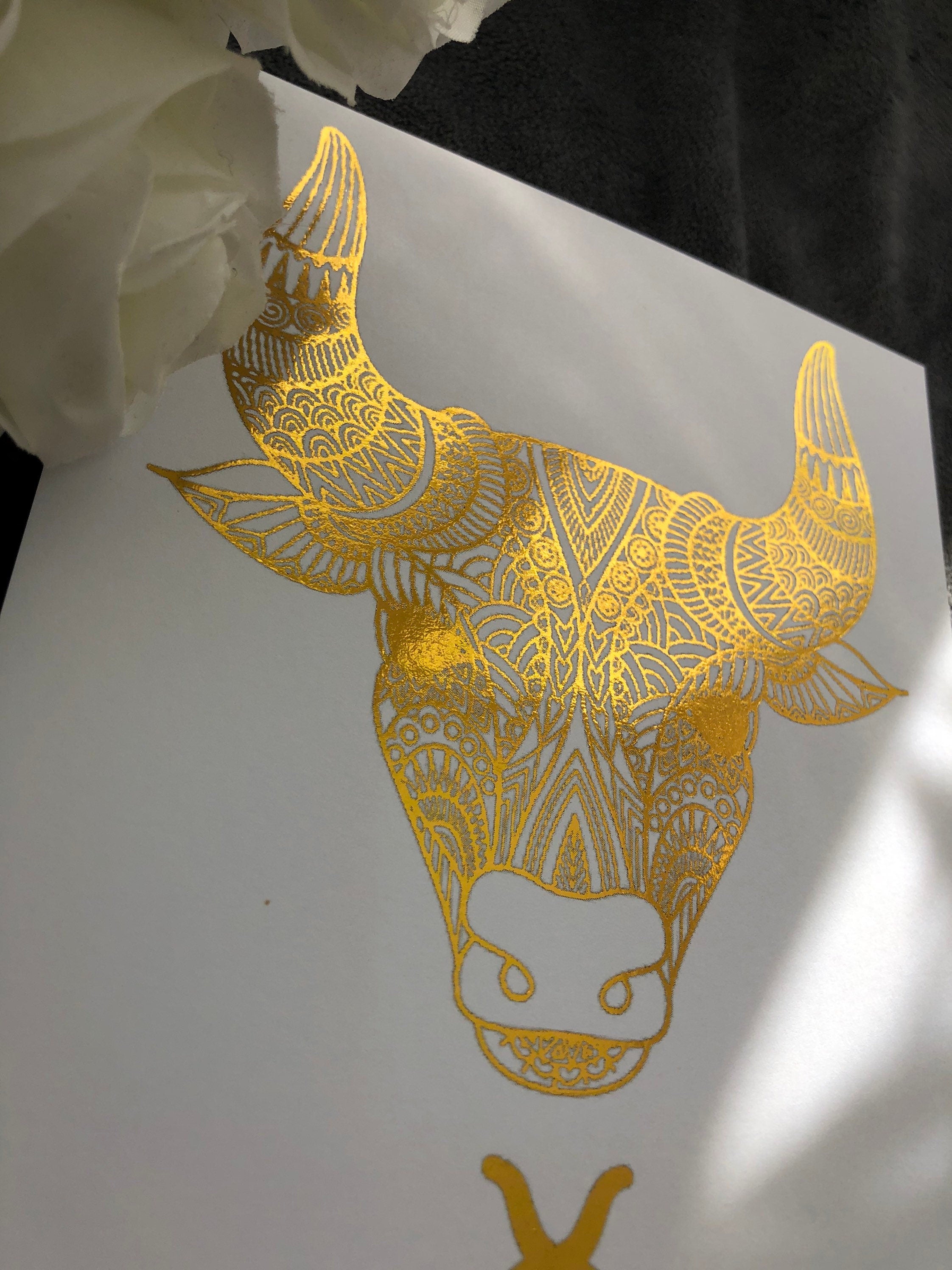 Taurus Star Sign Foil Print featuring a bull design with metallic accents, ideal for home decor.