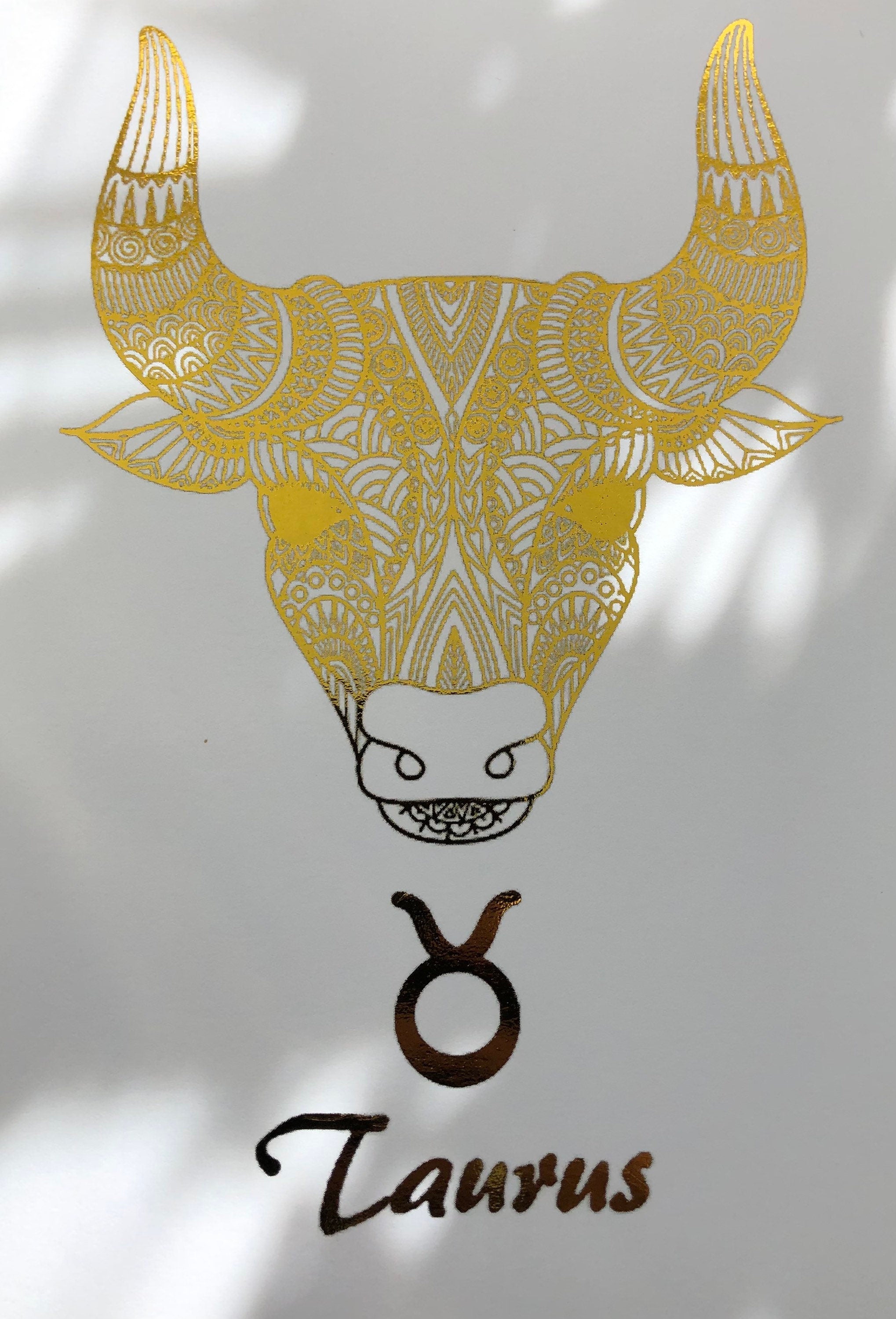 Taurus Star Sign Foil Print featuring a bull design with metallic accents, ideal for home decor.