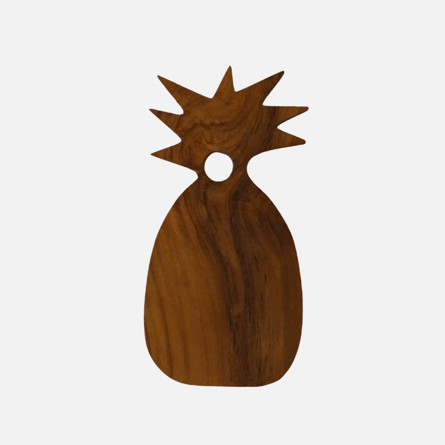 Teak wood serving plate shaped like a pineapple, showcasing its unique design and natural wood grain.