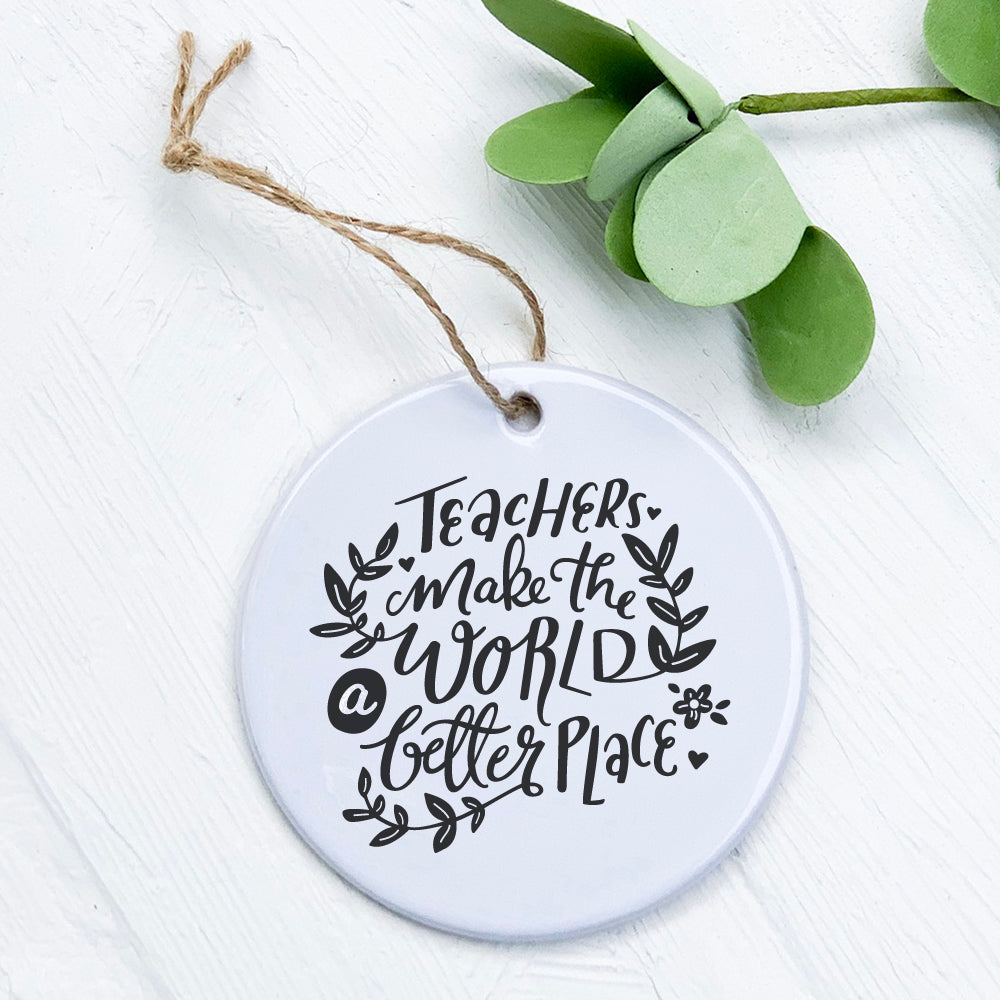 A beautifully crafted porcelain ornament featuring the phrase 'Teachers Make World Better', showcasing vibrant colors and a glossy finish.