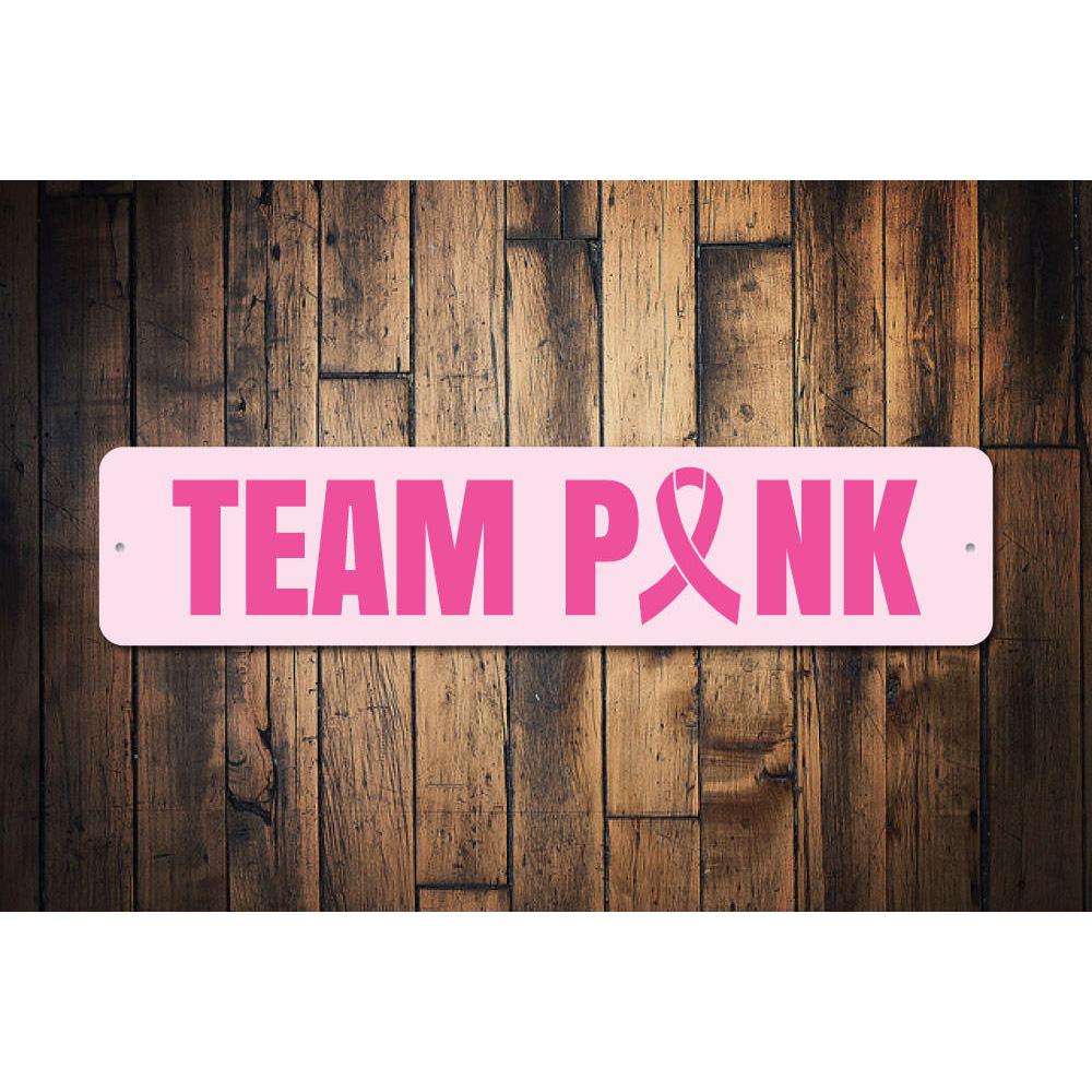 Customizable Team Pink Sign made from high-quality aluminum, featuring a vibrant pink design suitable for various indoor settings.