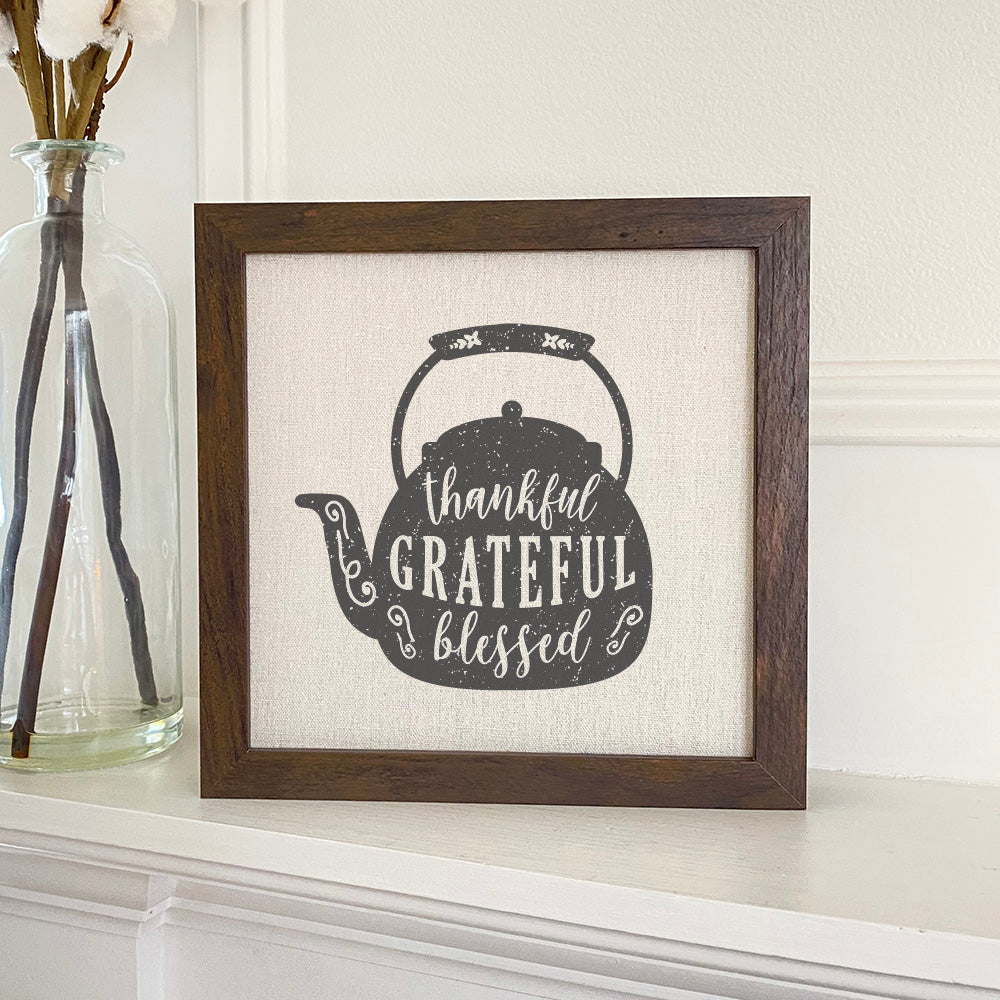 Thankful Teapot framed sign with a stylized wood frame, featuring eco-friendly ink printing on a linen-look background.