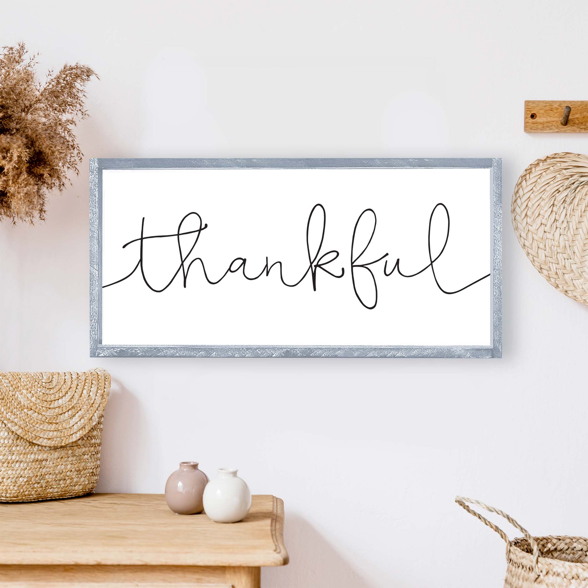 A rustic Thankful Wood Sign featuring a whimsical font on a white background, framed in stained pine wood, ideal for home decor.