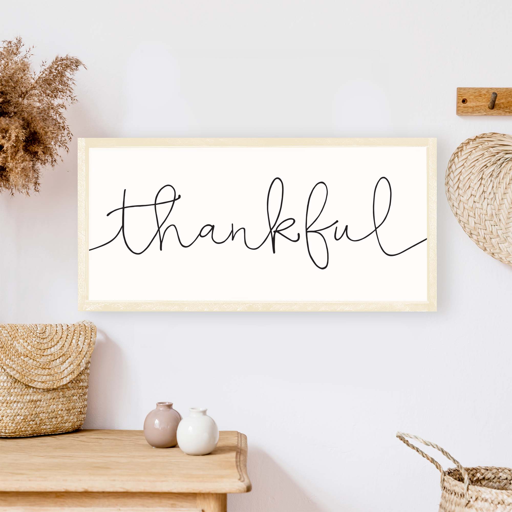 A rustic Thankful Wood Sign featuring a whimsical font on a white background, framed in stained pine wood, ideal for home decor.