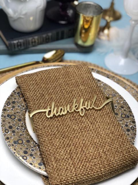 Set of 4 Thankful Matte Gold Napkin Wraps elegantly displayed in a stylish box.