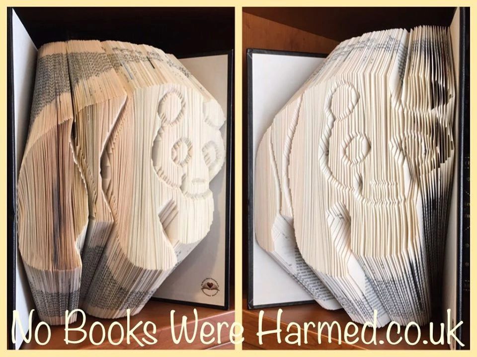 Hand-folded book art of a Giant Panda made from vintage Encyclopaedia Britannica pages, showcasing intricate details and unique design.