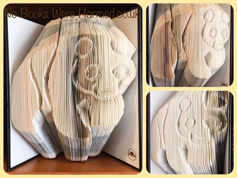 Hand-folded book art of a Giant Panda made from vintage Encyclopaedia Britannica pages, showcasing intricate details and unique design.