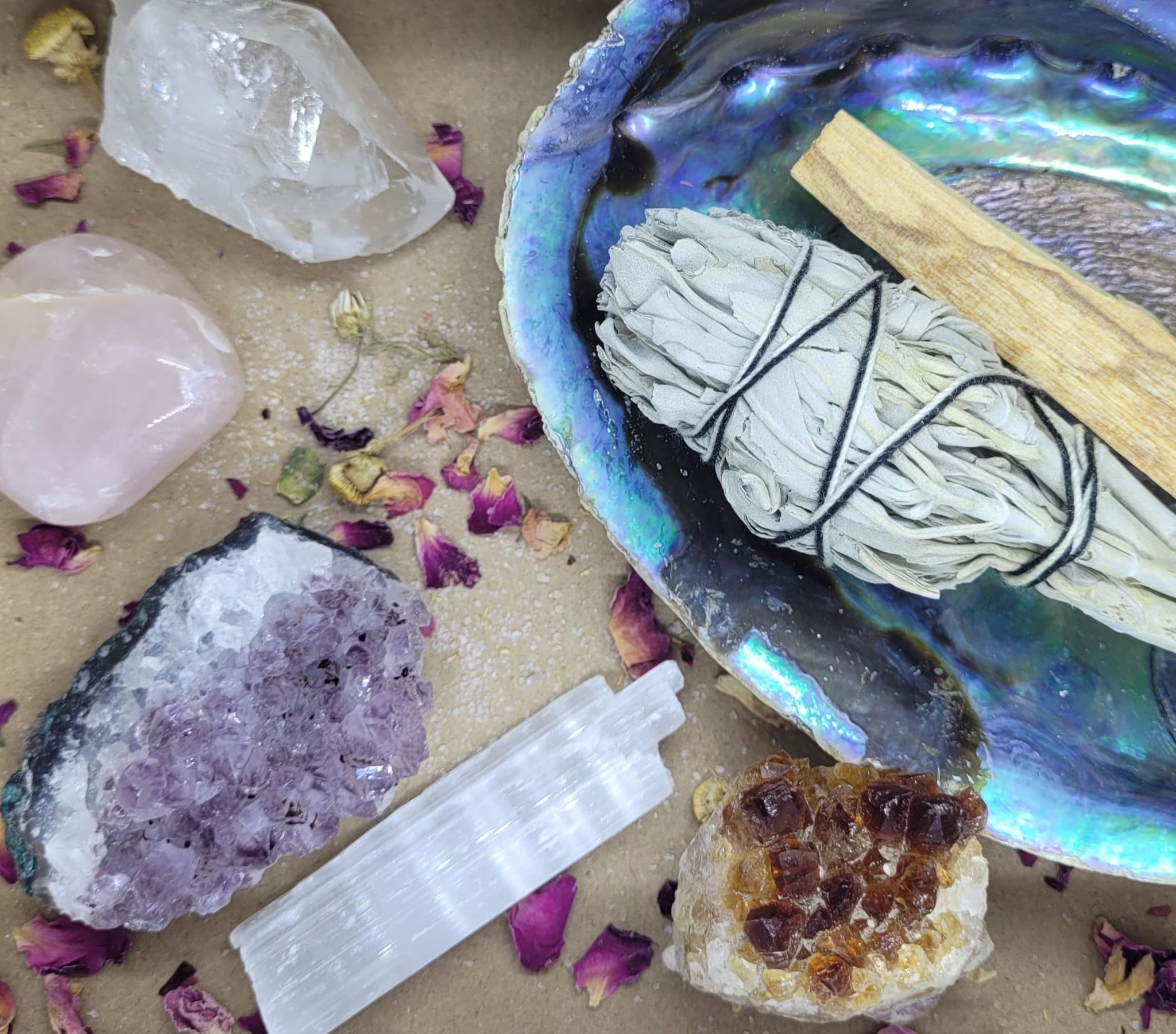 Crystals, sage bundle, and abalone shell