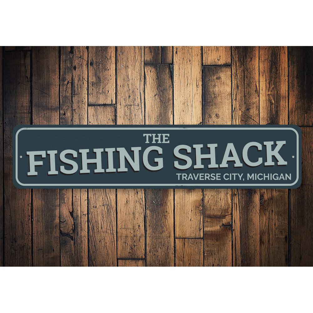 The Fishing Shack Sign, a customizable aluminum decorative sign featuring lake-themed design, perfect for lakehouses and outdoor decor.