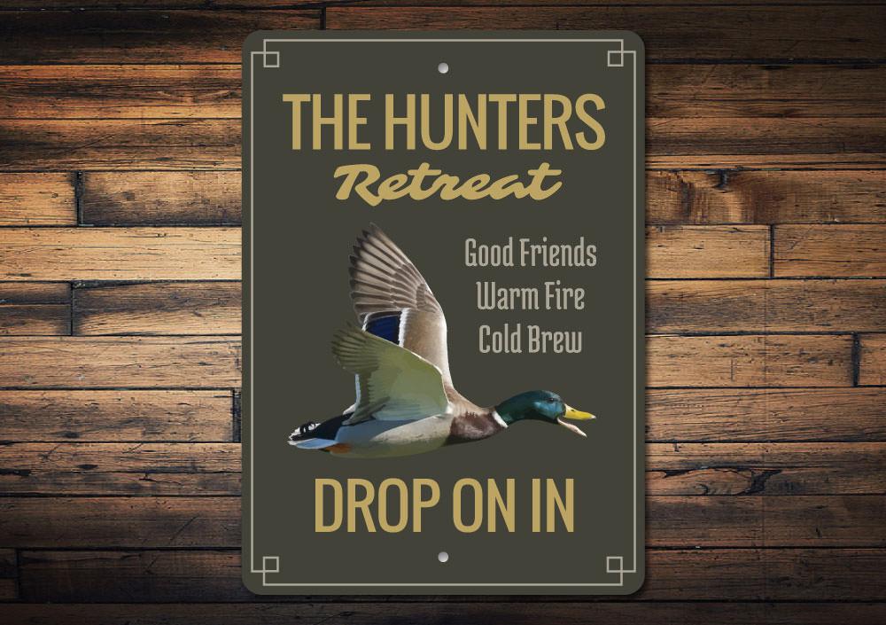 The Hunters Retreat Sign made of high-quality aluminum, featuring customizable text and pre-drilled holes for easy mounting.