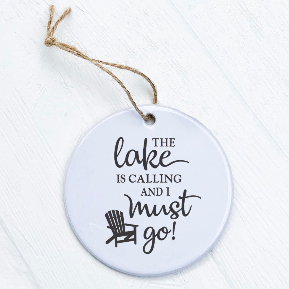 A beautifully crafted porcelain ornament featuring the design 'The Lake is Calling', showcasing vibrant colors and a glossy finish.