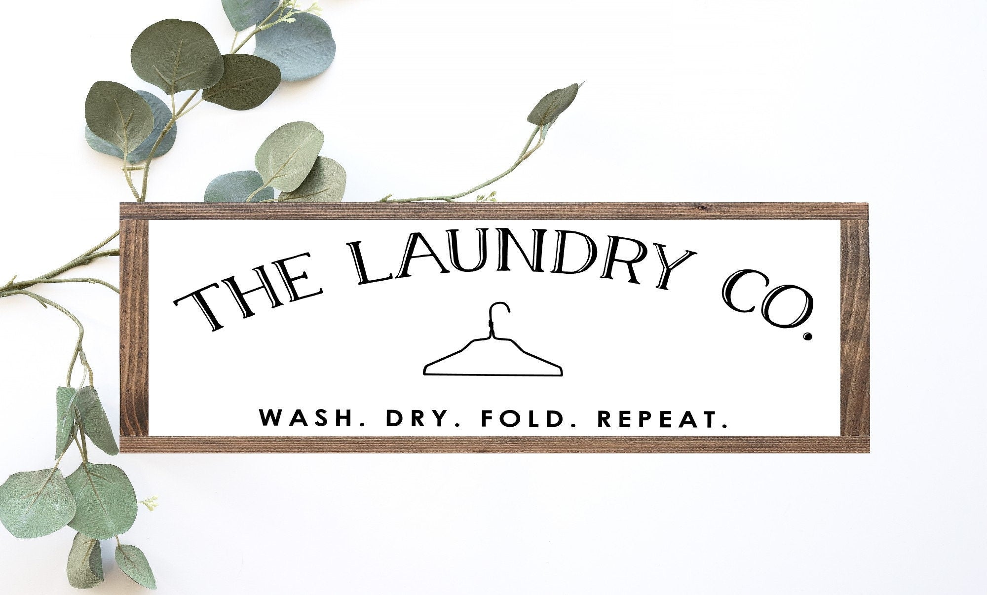 Handmade Laundry Co. Wood Sign in matte white finish, showcasing unique wood grain and knots, perfect for laundry room decor.