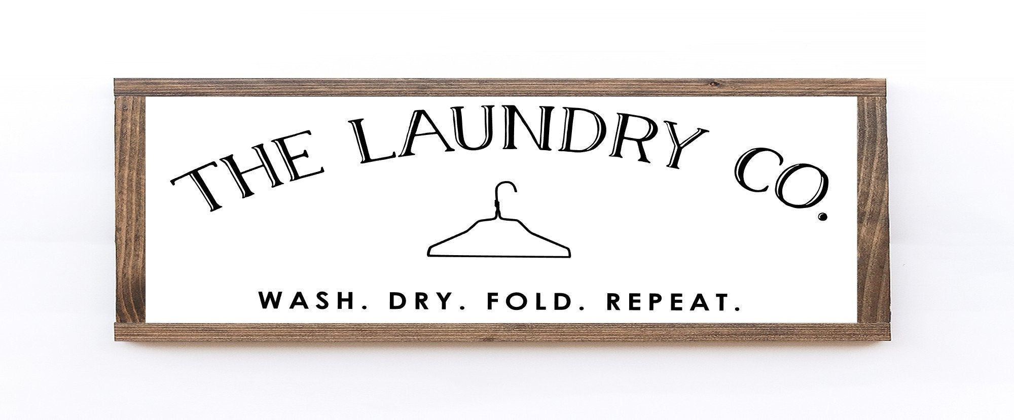 Handmade Laundry Co. Wood Sign in matte white finish, showcasing unique wood grain and knots, perfect for laundry room decor.