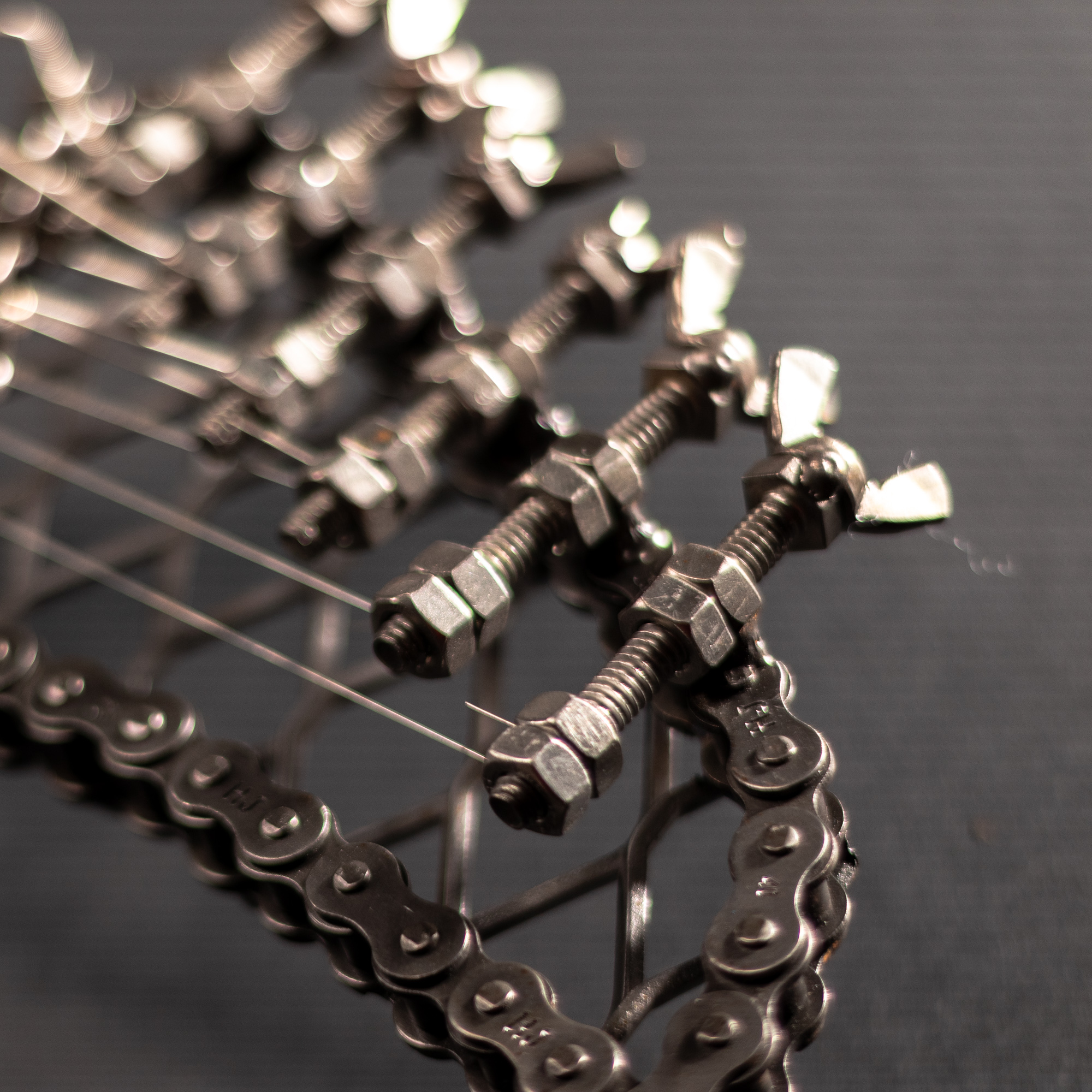 A handcrafted metal electric guitar sculpture, showcasing intricate details and a lifelike design, perfect for wall art enthusiasts.