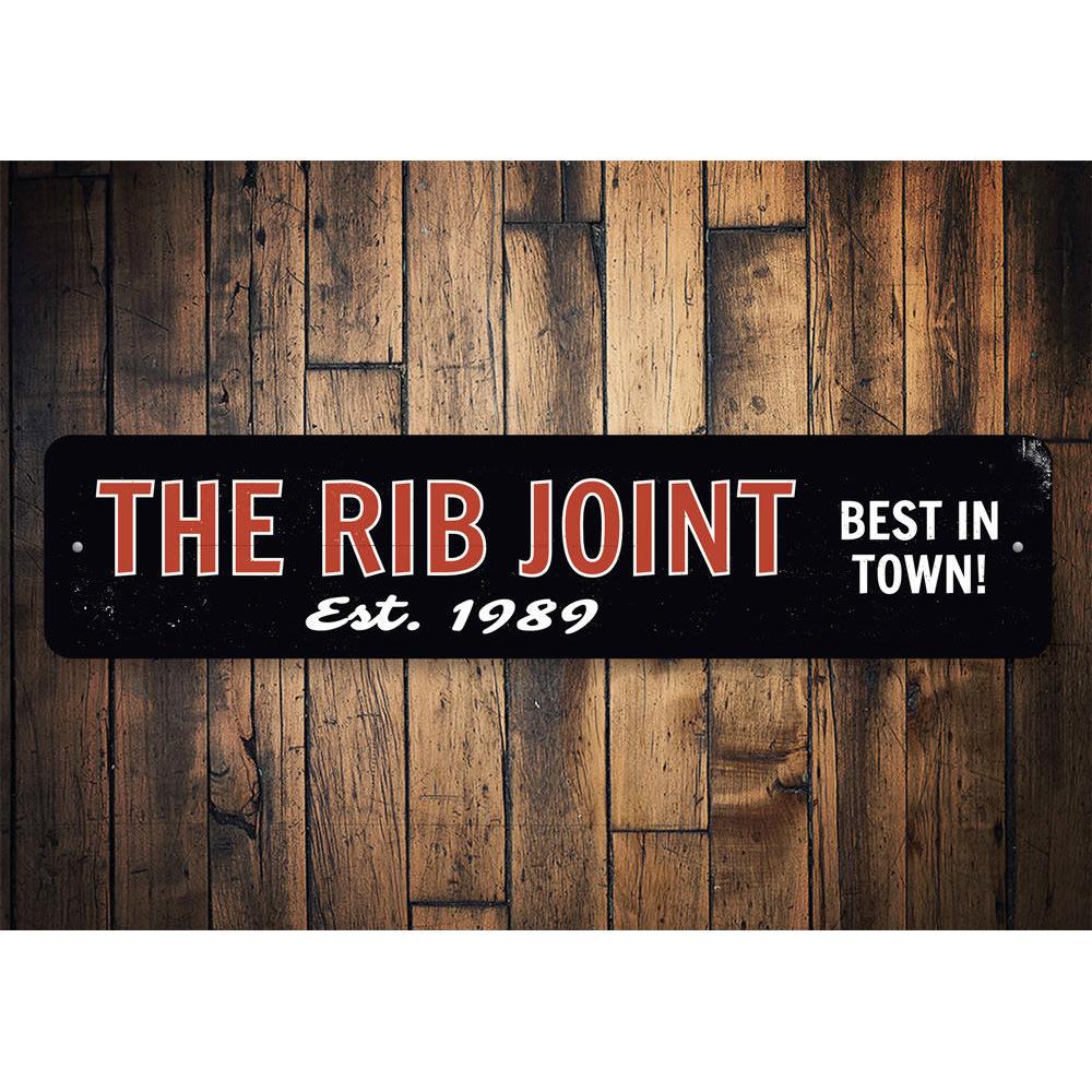 The Rib Joint Sign, a customizable aluminum wall sign featuring vibrant colors and pre-drilled holes for easy mounting.