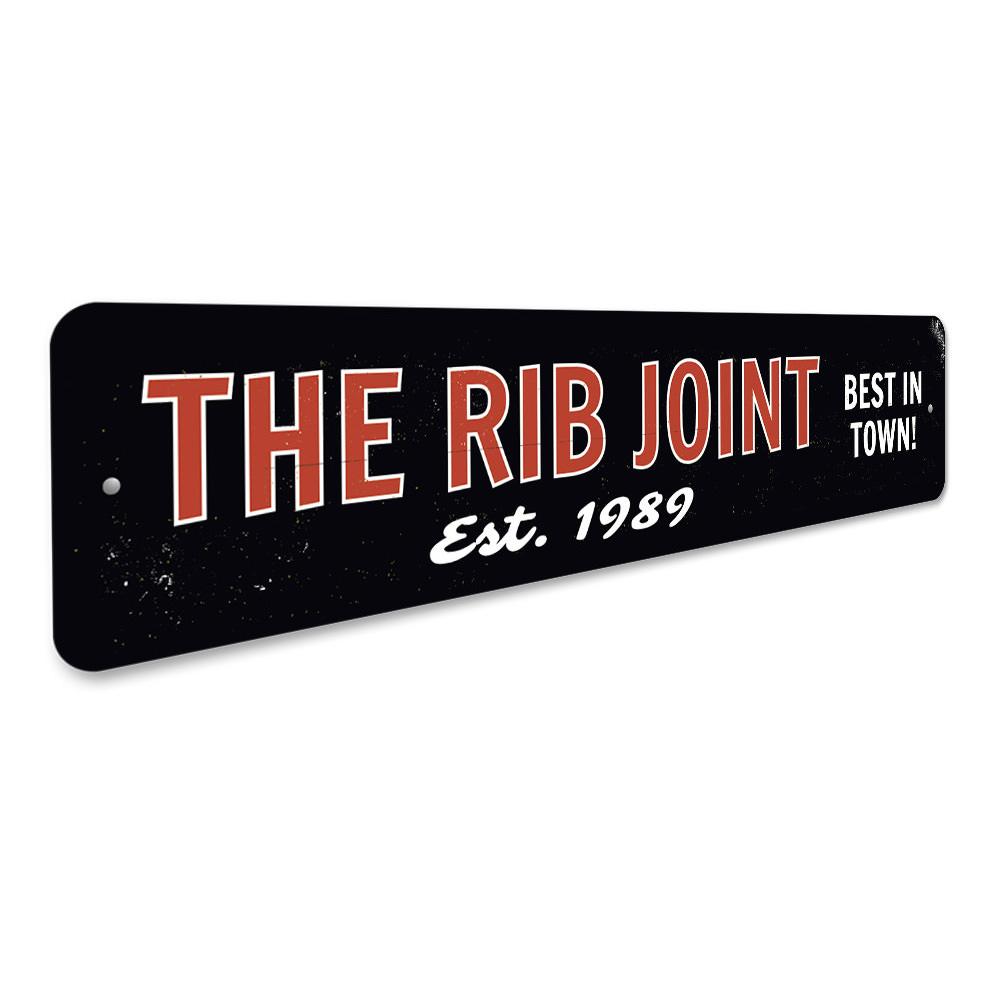 The Rib Joint Sign, a customizable aluminum wall sign featuring vibrant colors and pre-drilled holes for easy mounting.