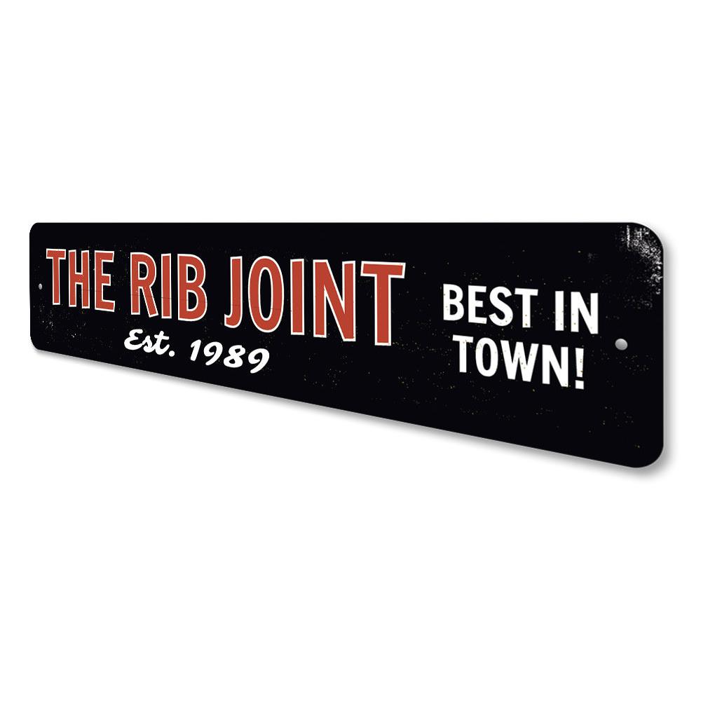 The Rib Joint Sign, a customizable aluminum wall sign featuring vibrant colors and pre-drilled holes for easy mounting.