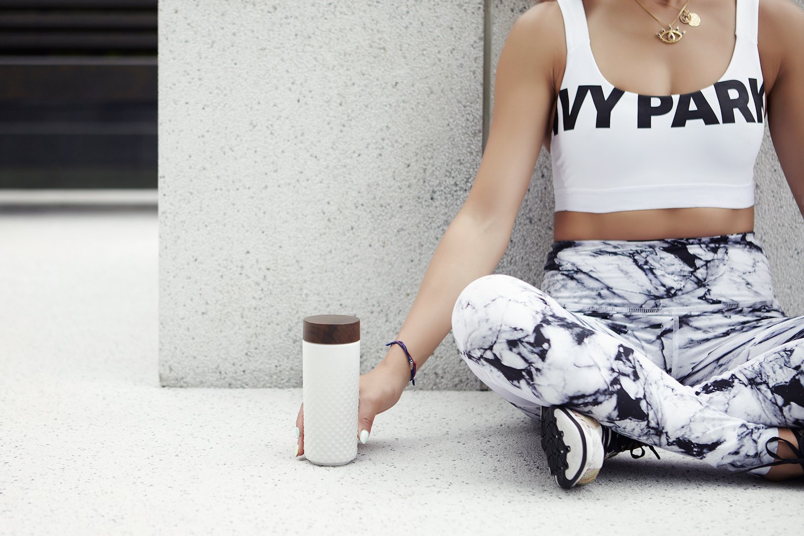 Ceramic double-wall water bottle with a starry night design, featuring raised stars and a sleek bamboo effect lid.