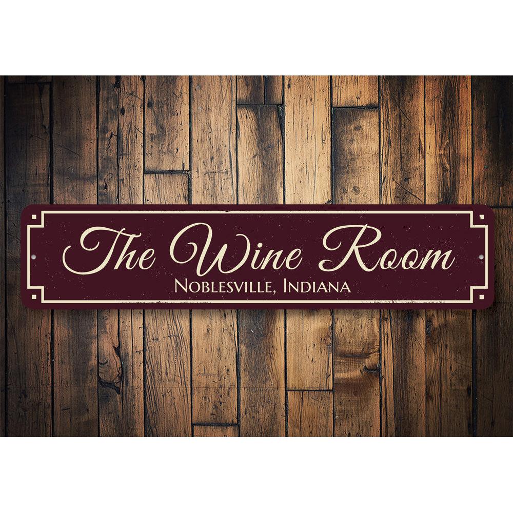 A decorative aluminum sign reading 'The Wine Room', featuring elegant typography and a rustic design, perfect for wine enthusiasts.