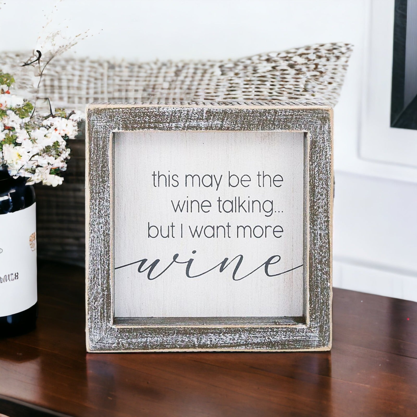 A decorative piece featuring a witty quote about wine, perfect for wine lovers, measuring 5x5x1.5 inches.